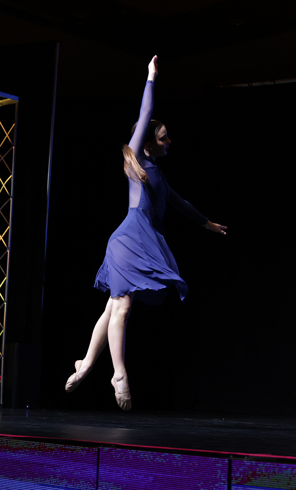 Ballerina in the air dressed in blue